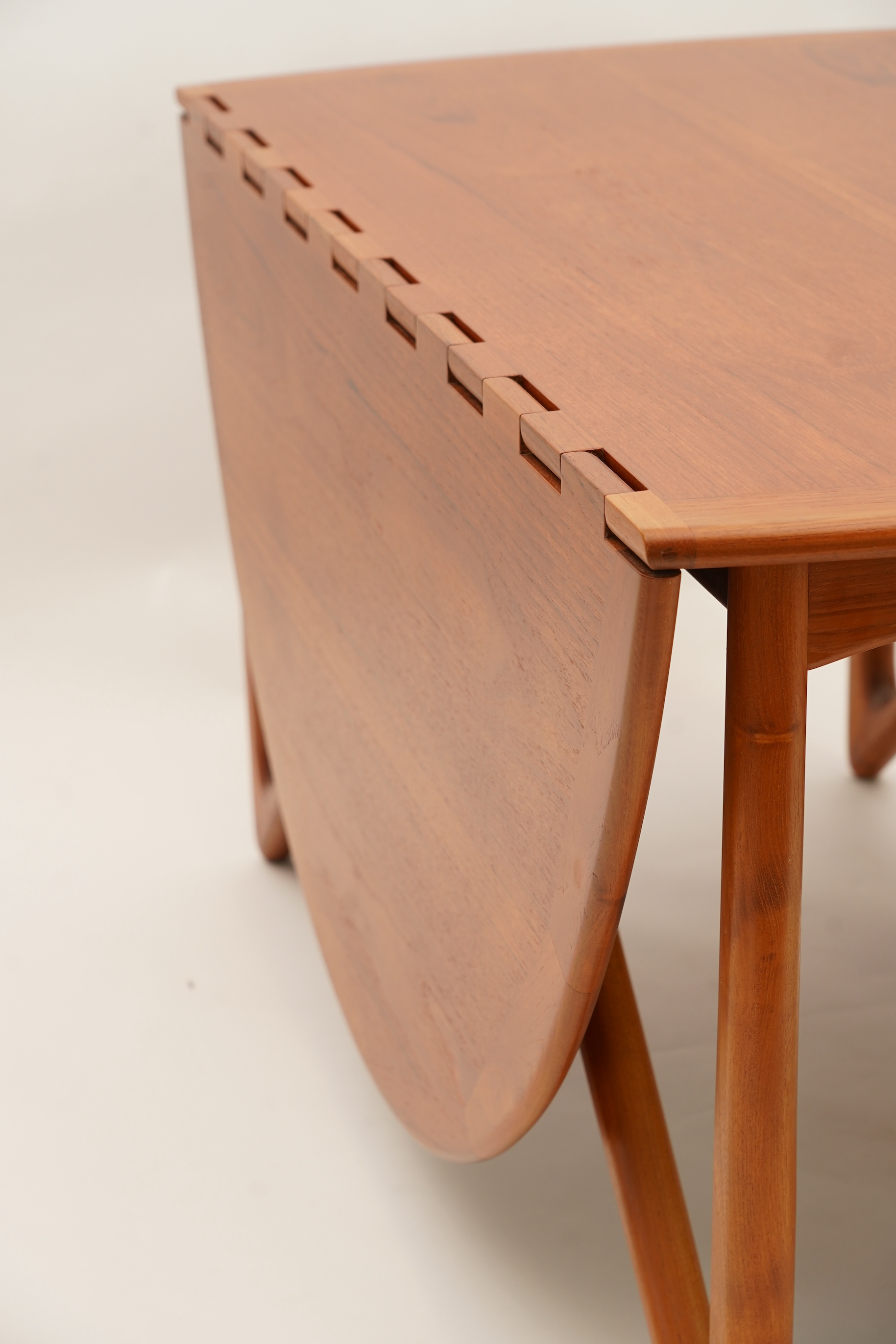 Niels Koefoed (Danish, b. 1929) for Koefoeds Møbelfabrik: A teak 'Oval Klap' dining table
